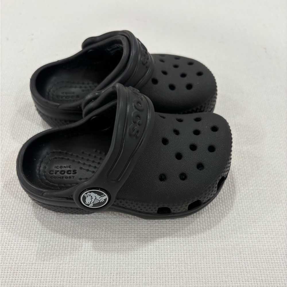 CROCS Black Slip-On Shoes for Baby size 4 with back strap and made for comfort!